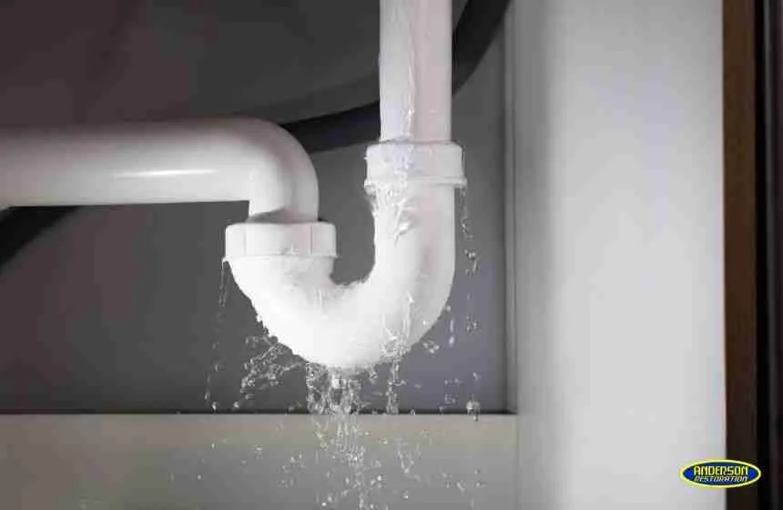 Leaking sink drain pipe causing water damage under cabinet