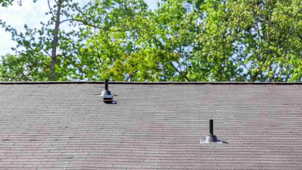 Close-up of newly installed dimensional architectural shingles showing the layered texture and color variation on a Houston-area residential roof