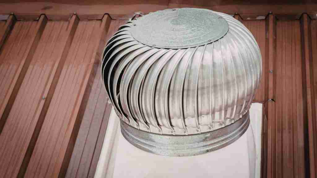 Roofer installing a continuous ridge vent