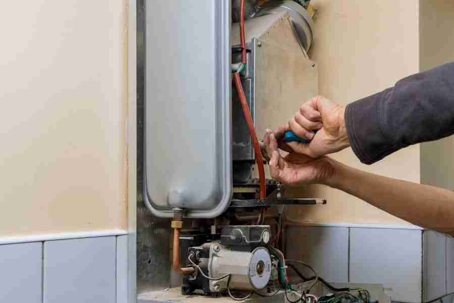 Aging water heater showing signs of wear and potential failure