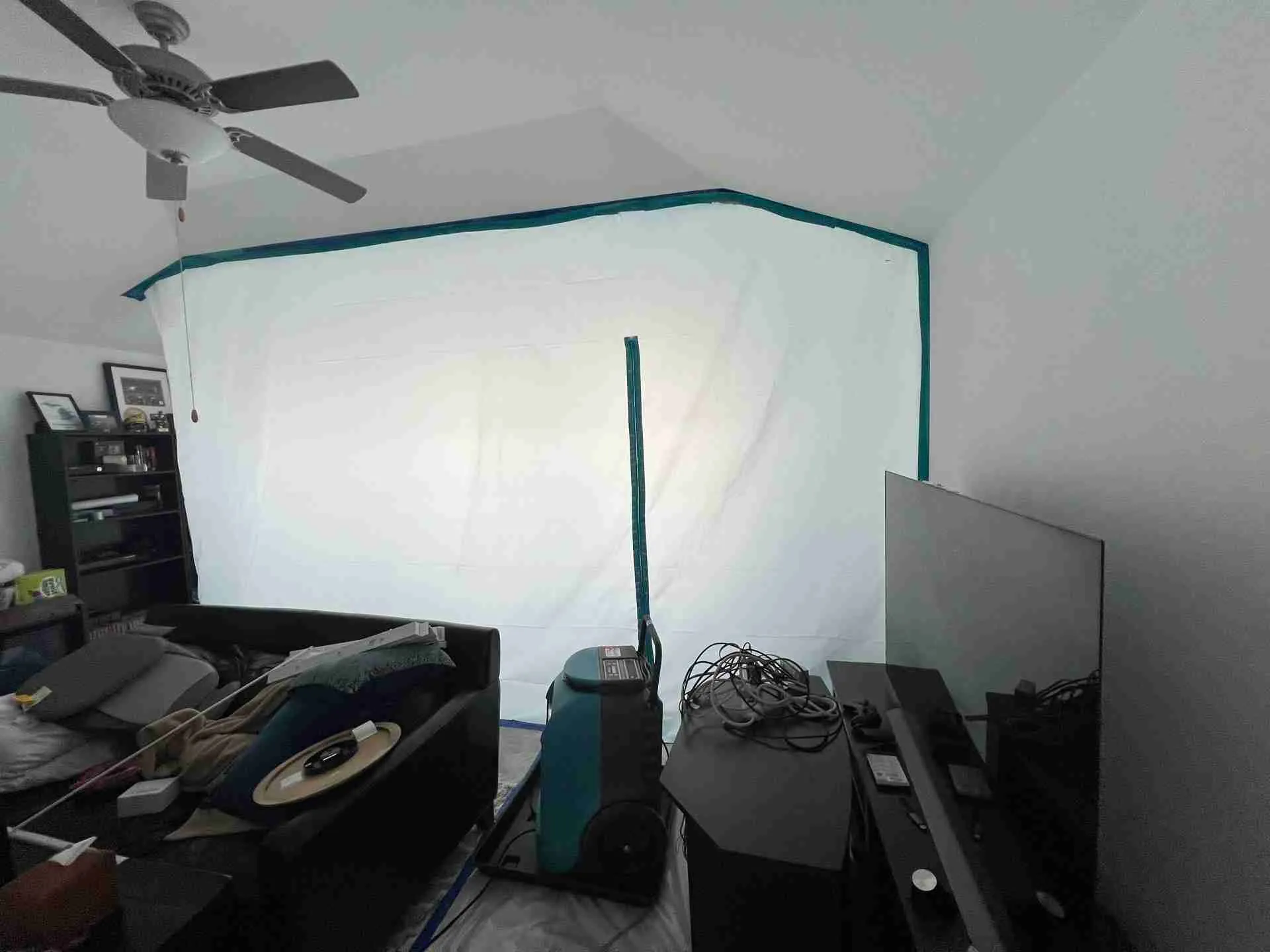 Full room containment with a HEPA air scrubber running during active mold remediation
