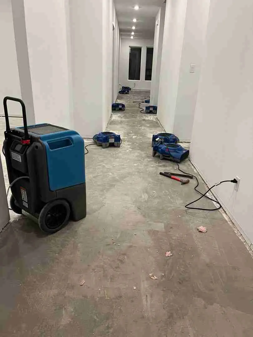 Drying equipment staged along a hallway during residential water damage restoration in Fulshear TX